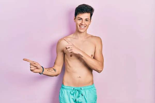 Young Hispanic Man Wearing Swimwear Shirtless Smiling Looking Camera Pointing — Stock Photo, Image