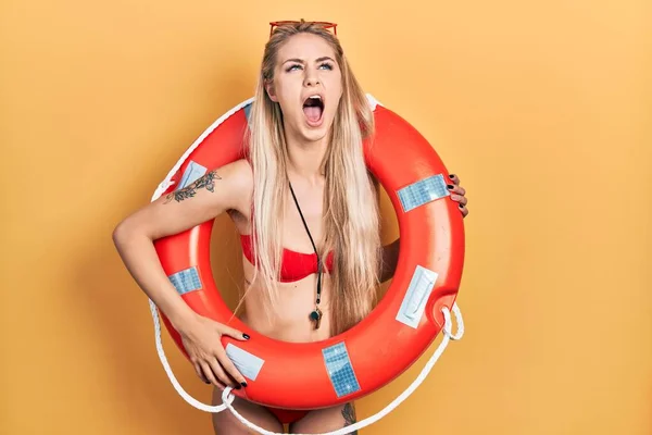 Young Caucasian Woman Wearing Bikini Holding Lifeguard Float Angry Mad — Stock Photo, Image