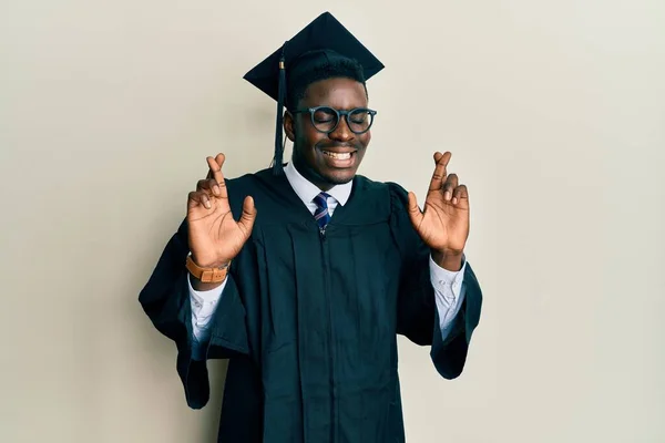Handsome Black Man Wearing Graduation Cap Ceremony Robe Gesturing Finger — Stock Photo, Image