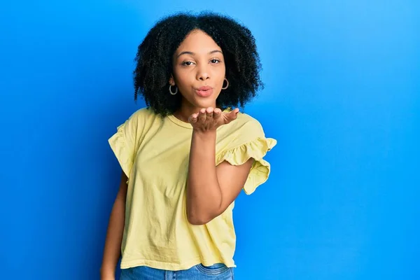 Young African American Girl Wearing Casual Clothes Looking Camera Blowing — Stock Photo, Image