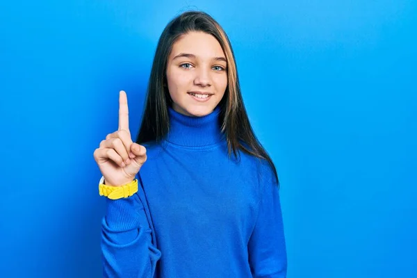 Young Brunette Girl Wearing Turtleneck Sweater Pointing Finger Successful Idea — Stock Photo, Image