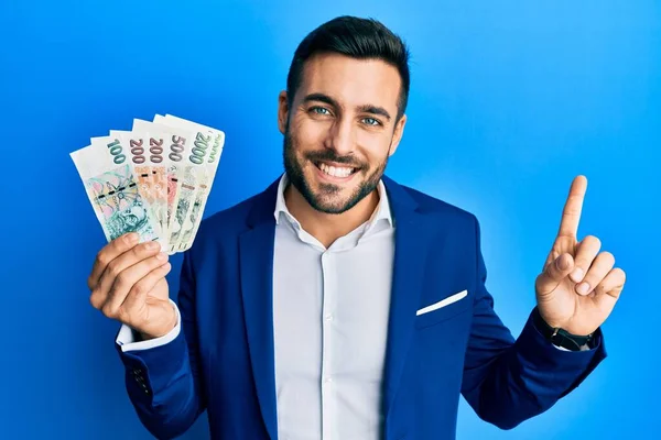 Young Hispanic Businessman Wearing Business Suit Holding Czech Koruna Banknotes — Stock Photo, Image