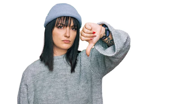 Young Hispanic Woman Wearing Cute Wool Cap Looking Unhappy Angry — Stock Photo, Image