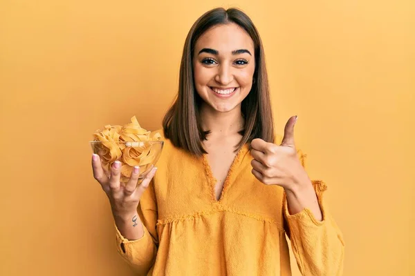 Young Brunette Girl Holding Bowl Spaghetti Smiling Happy Positive Thumb — Stock Photo, Image