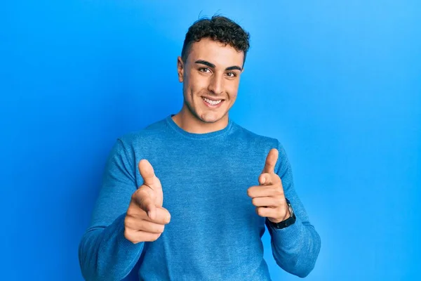 Hispanic Young Man Wearing Casual Winter Sweater Pointing Fingers Camera — Stock Photo, Image