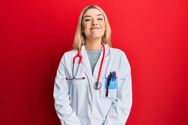 Young Caucasian Woman Wearing Doctor Uniform Stethoscope Puffing Cheeks Funny — Stock Photo, Image
