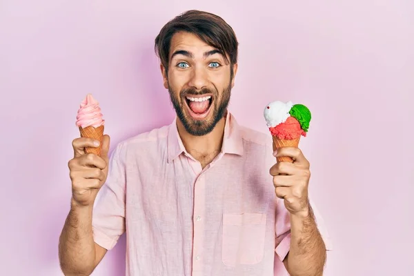 Young Hispanic Man Holding Ice Cream Celebrating Crazy Amazed Success — Stock Photo, Image