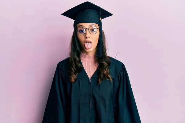 Young Hispanic Woman Wearing Graduation Cap Ceremony Robe Sticking Tongue — Stock Photo, Image