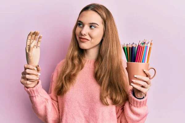Young Blonde Woman Holding Small Wooden Manikin Hand Pencils Smiling — Stock Photo, Image