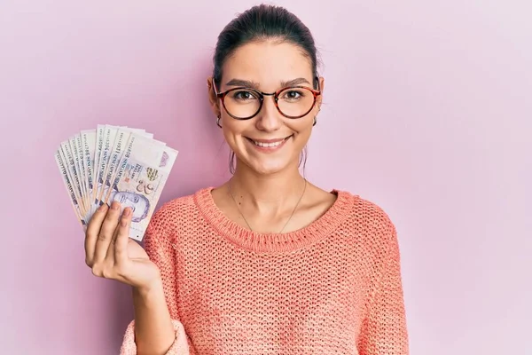 Young Caucasian Woman Holding Singapore Dollars Banknotes Looking Positive Happy — Stock Photo, Image