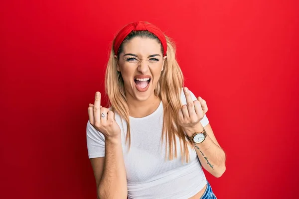 Young Caucasian Woman Wearing Casual White Shirt Showing Middle Finger — Stockfoto