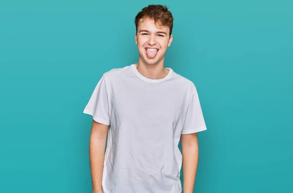 Young Caucasian Man Wearing Casual White Shirt Sticking Tongue Out — Stock Photo, Image