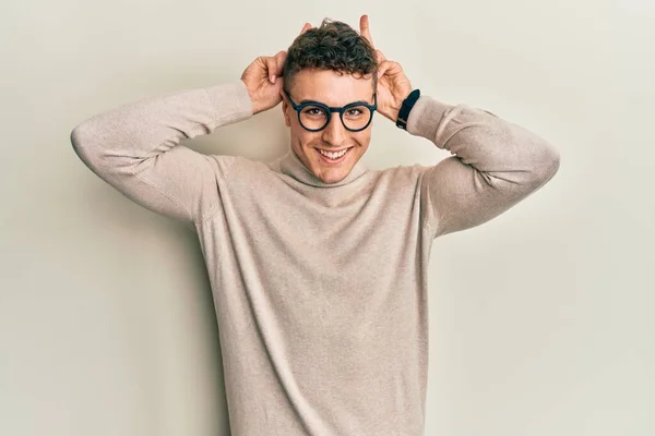 Hispanic Young Man Wearing Casual Turtleneck Sweater Posing Funny Crazy — Stock Photo, Image