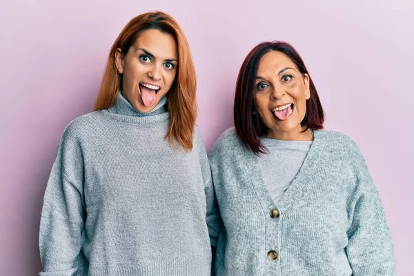 Latin Mother Daughter Wearing Casual Clothes Sticking Tongue Out Happy — Stock Photo, Image