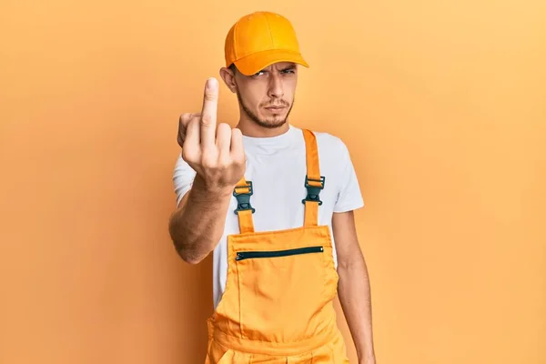 Hispanic Young Man Wearing Handyman Uniform Showing Middle Finger Impolite — Stok fotoğraf