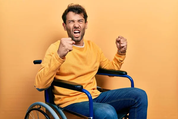 Handsome Man Beard Sitting Wheelchair Angry Mad Raising Fists Frustrated — Stock Photo, Image