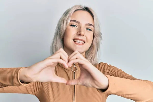 Young Blonde Girl Wearing Casual Clothes Smiling Love Doing Heart — Stock Photo, Image
