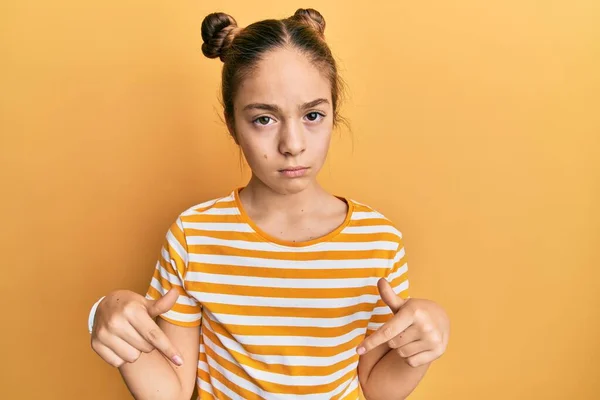 Beautiful Brunette Little Girl Wearing Casual Striped Shirt Pointing Looking — Stock Photo, Image