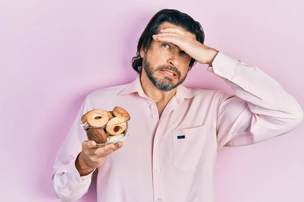 Middle Age Caucasian Man Holding Sweet Pastries Stressed Frustrated Hand — Stock Photo, Image