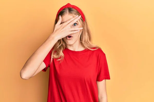 Beautiful Young Caucasian Girl Wearing Casual Red Shirt Peeking Shock — Stock Photo, Image