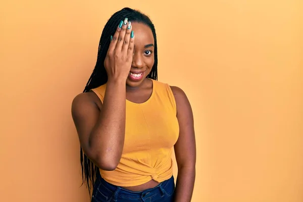 Young African American Woman Wearing Casual Clothes Covering One Eye — Stock Photo, Image