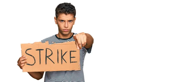Young Handsome African American Man Holding Strike Banner Cardboard Pointing — Stock Photo, Image