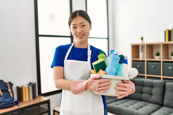 Young Chinese Housewife Holding Cleaning Products Standing Home — Stock Photo, Image