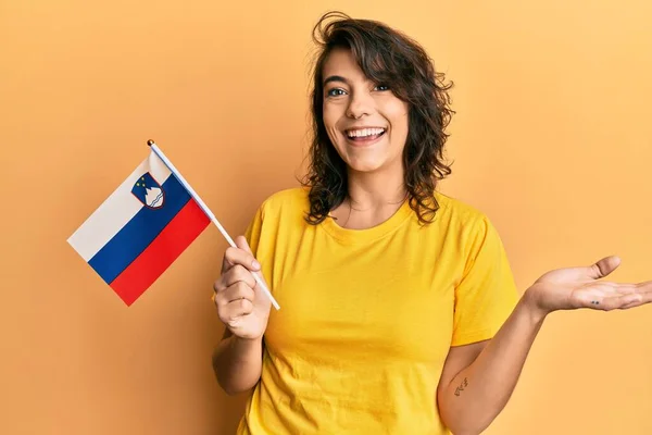 Young Hispanic Woman Holding Slovenia Flag Celebrating Achievement Happy Smile — Stock Photo, Image