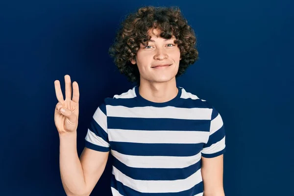 Handsome Young Man Wearing Casual Striped Shirt Showing Pointing Fingers — Stock Photo, Image