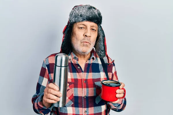 Handsome Mature Handyman Wearing Winter Hat Ear Flaps Drinking Hot — Stock Photo, Image