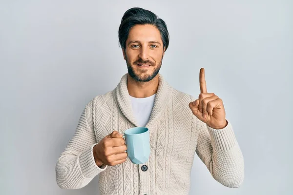 Young Hispanic Man Drinking Cup Coffee Smiling Idea Question Pointing — Stock Photo, Image