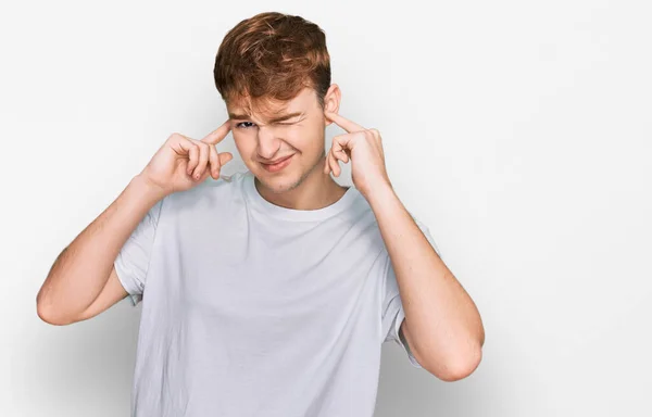 Young Caucasian Man Wearing Casual White Shirt Covering Ears Fingers — Stock Photo, Image