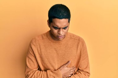 Genç, yakışıklı İspanyol bir adam, hazımsızlık, acı veren hastalıklar yüzünden elleri karnında, sıradan bir kazak giyiyor. Ağrı kavramı. 