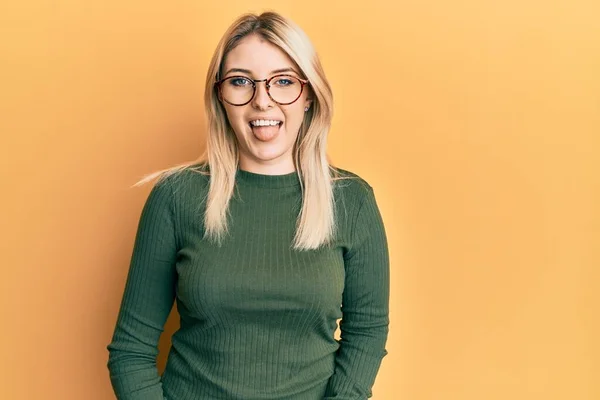 Young Caucasian Woman Wearing Casual Clothes Glasses Sticking Tongue Out — Stock Photo, Image