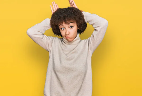 Young Hispanic Girl Wearing Wool Winter Sweater Doing Bunny Ears — Stock Photo, Image