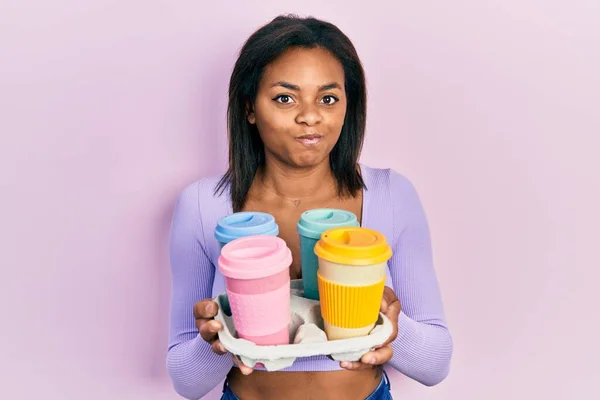 Young African American Girl Holding Tray Take Away Coffee Skeptic — Stock Photo, Image