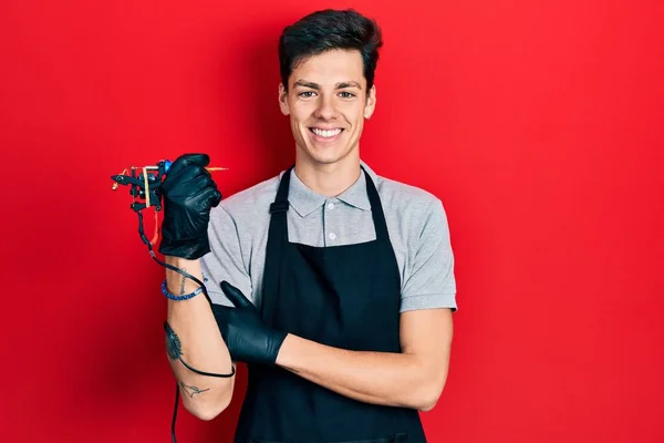 Young Hispanic Man Tattoo Artist Wearing Professional Uniform Gloves Holding — Stock Photo, Image