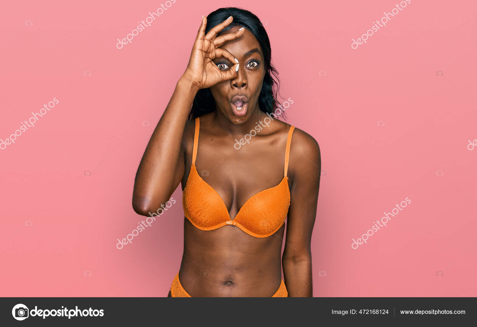 Laughing woman in bra and panties - Stock Photo - Dissolve