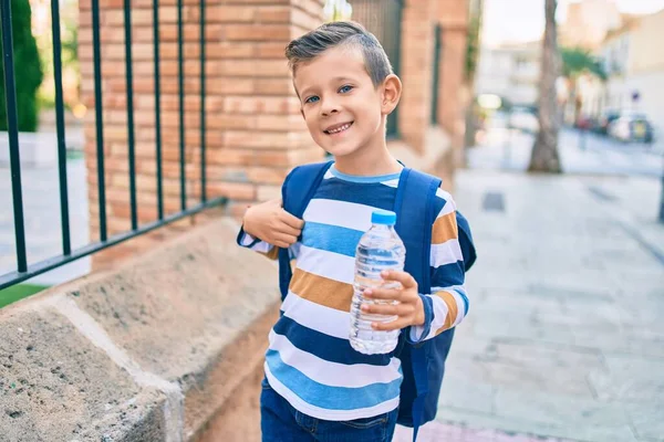 Adorable Caucasian Student Boy Smiling Happy Holding Bottle Water Standing — Stock Photo, Image