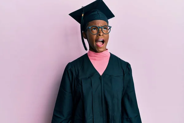Young African American Girl Wearing Graduation Cap Ceremony Robe Angry — Stock Photo, Image