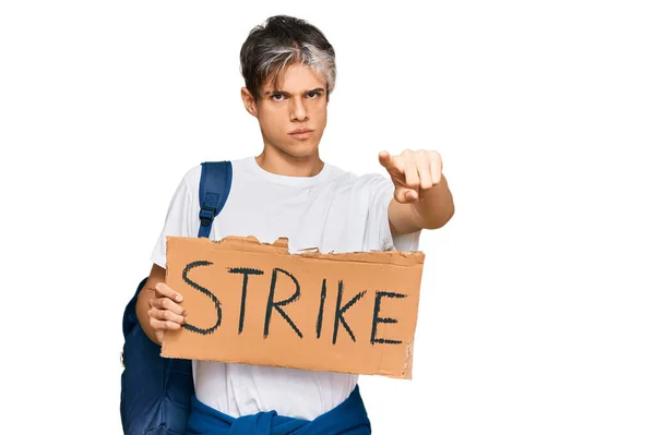 Young Hispanic Man Holding Strike Banner Cardboard Pointing Finger Camera — Stock Photo, Image