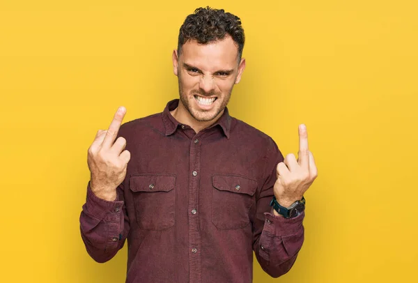 Young Hispanic Man Wearing Casual Clothes Showing Middle Finger Doing — Stockfoto