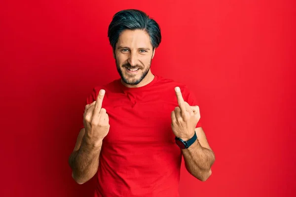 Young Hispanic Man Wearing Casual Red Shirt Showing Middle Finger — Stock Photo, Image