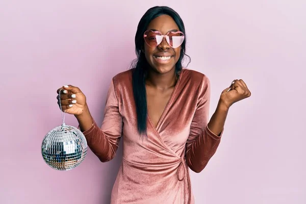Young African American Woman Wearing Sexy Party Dress Holding Disco Stock Photo