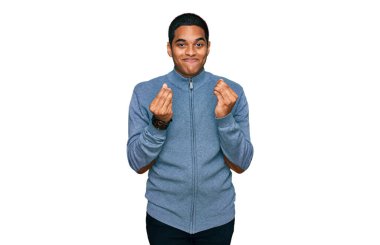 Genç, yakışıklı, İspanyol gömlekli, sıradan bir adam. Elleriyle para hareketi yapıyor. Maaş ve milyoner işi istiyor. 