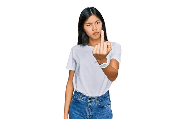 Beautiful Young Asian Woman Wearing Casual White Shirt Showing Middle — Zdjęcie stockowe