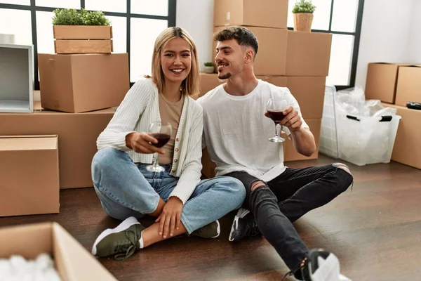 Young Caucasian Couple Toasting Red Wine Glass Sitting New Home — Stock Photo, Image