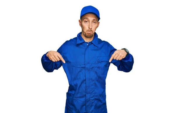 Bald Man Beard Wearing Builder Jumpsuit Uniform Pointing Looking Sad — Stock Photo, Image