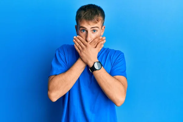 Young Caucasian Man Wearing Casual Blue Shirt Shocked Covering Mouth — Stock Photo, Image