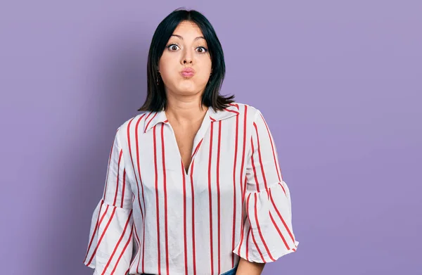 Young Hispanic Girl Wearing Casual Clothes Puffing Cheeks Funny Face — Stock Photo, Image